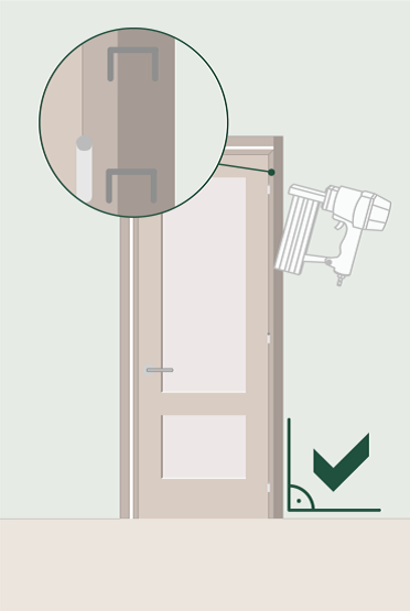 installation of door screwing frame into wall