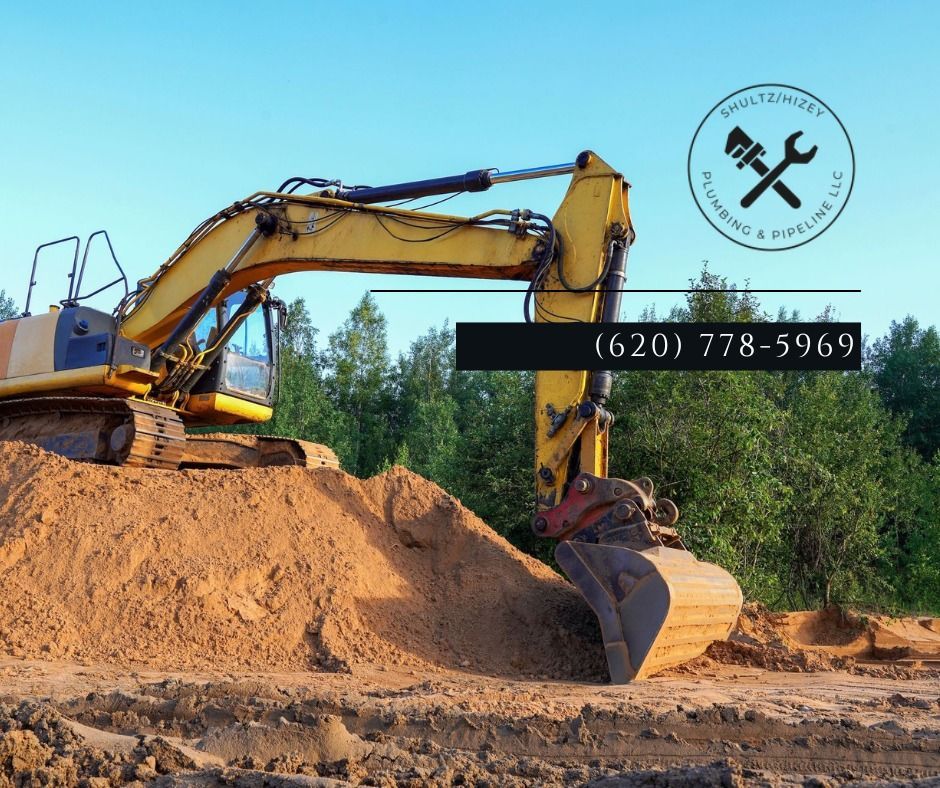 Yellow excavator scoops dirt in an outdoor setting. Phone number: (620) 778-5969, business logo in the corner.