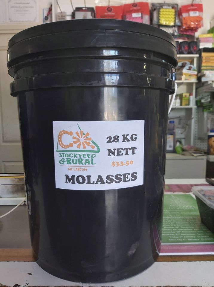 A black bucket with a white label on it is sitting on a counter.