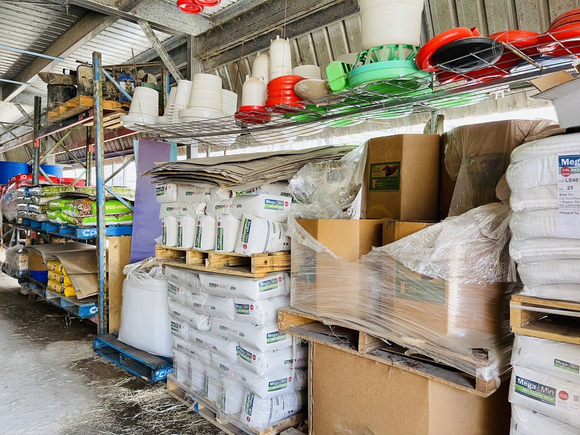 A warehouse filled with lots of containers and boxes.