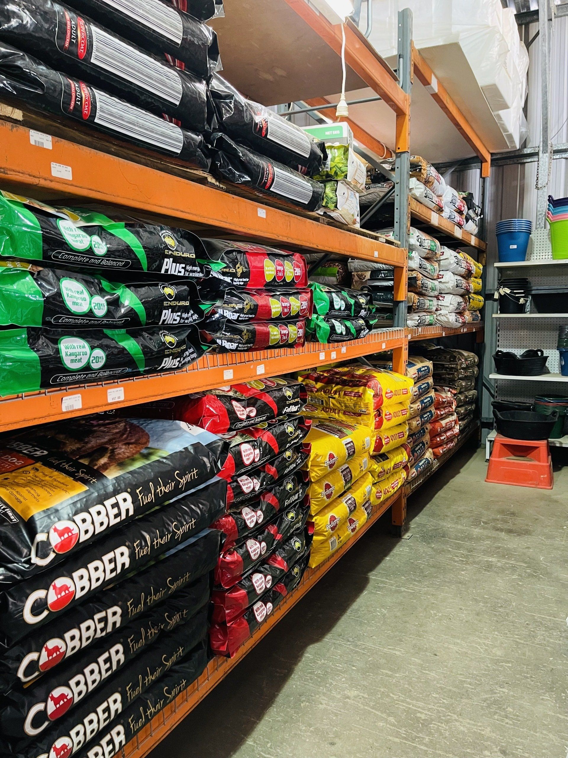 A warehouse filled with shelves filled with bags of food.