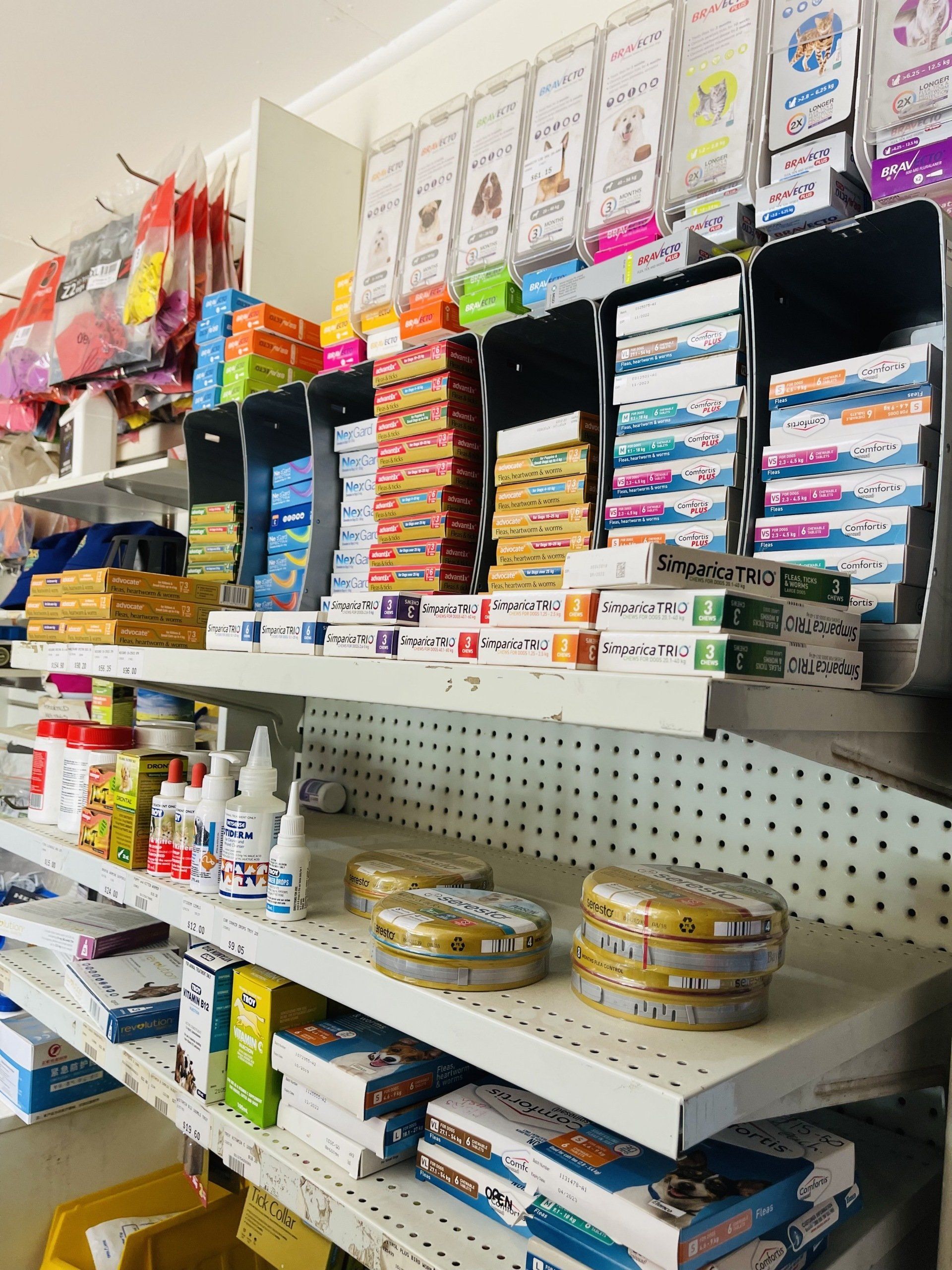A shelf in a store filled with lots of products.