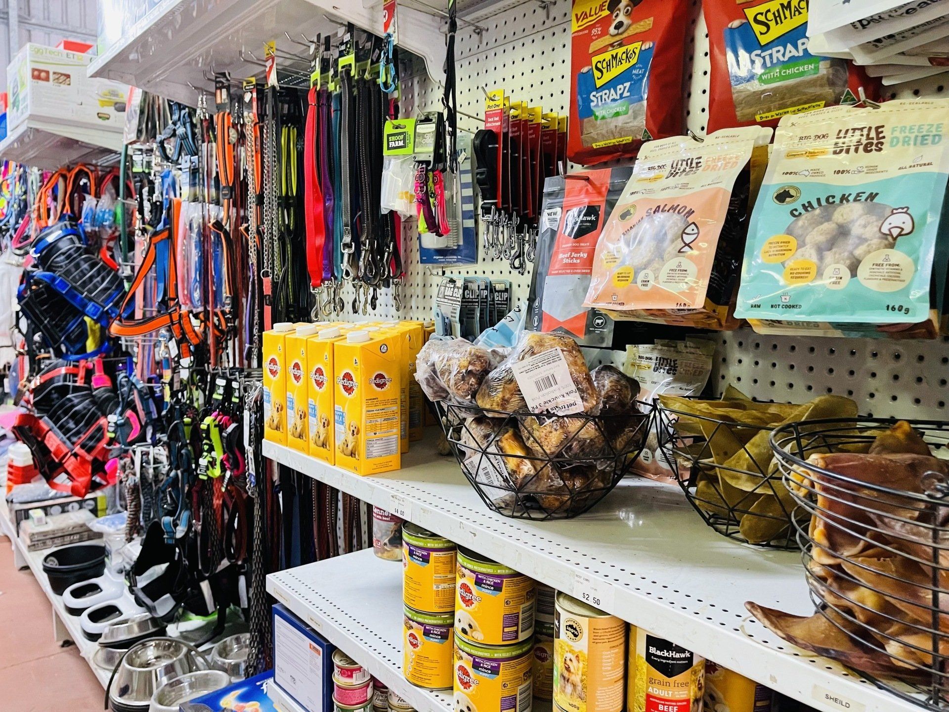 A pet store filled with lots of products for dogs and cats.