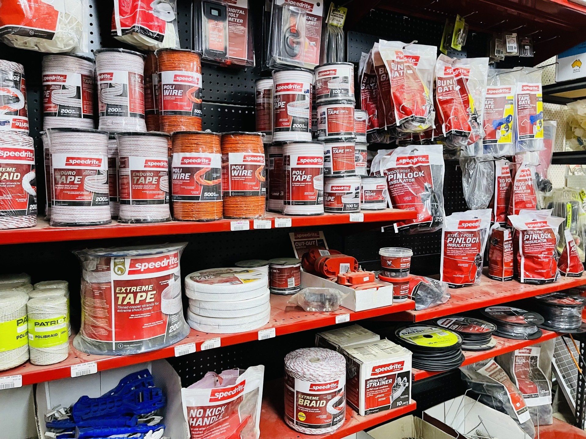 A store shelf filled with lots of different types of tape.