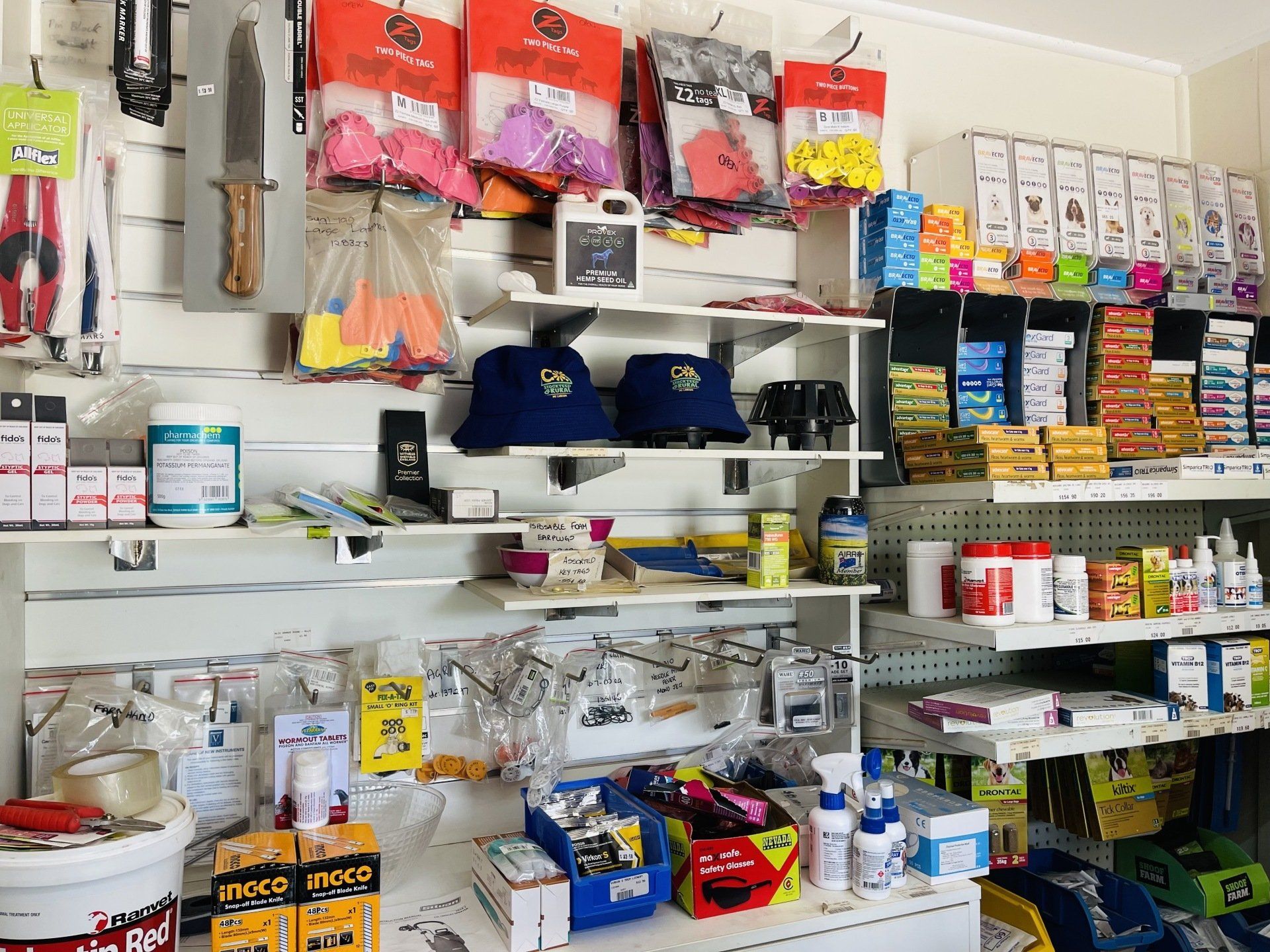 A store filled with lots of products including hats and buckets.