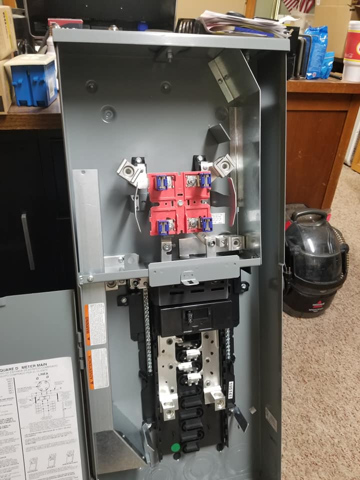 a electrical box is sitting on the floor in a room .