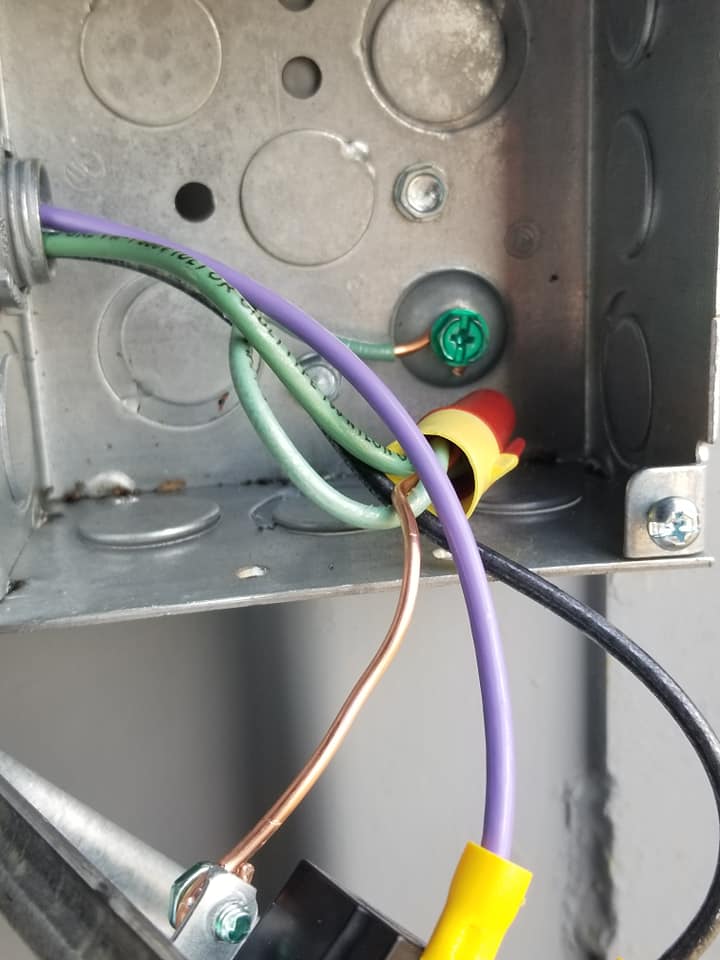a bunch of wires are connected to a metal box