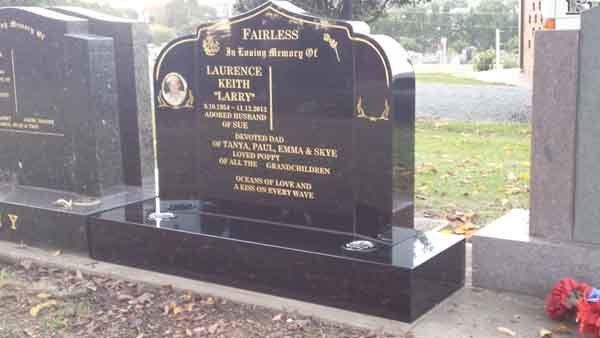 black square custom headstone with gold writing