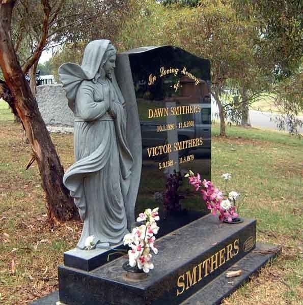 headstone of concrete angle next to it