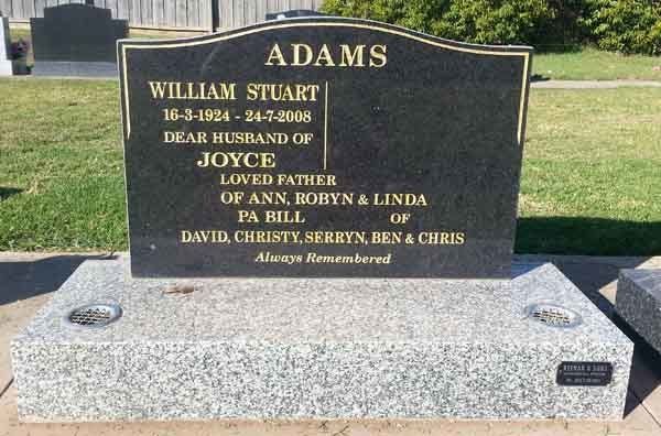 black headstone with gold accents