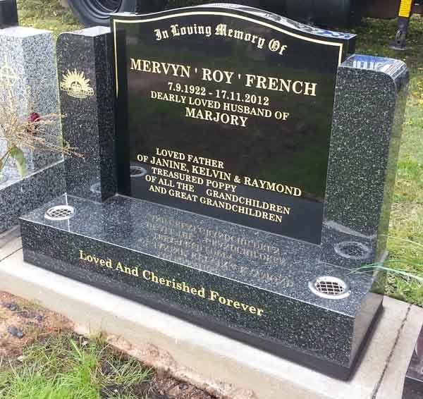 gold writing on headstone