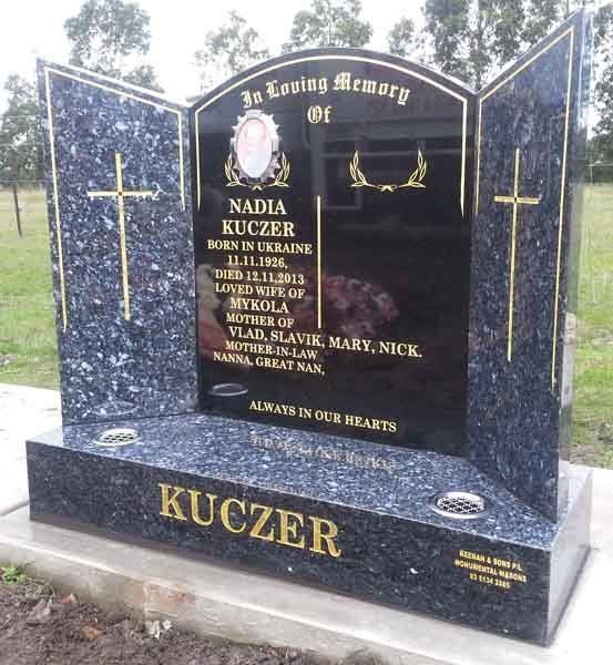 large gold headstone