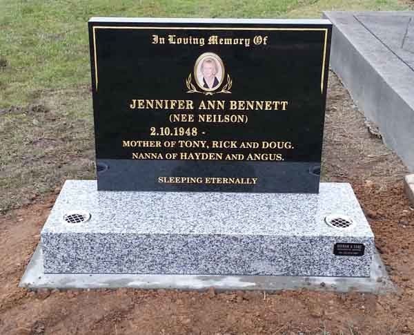 black headstone with picture