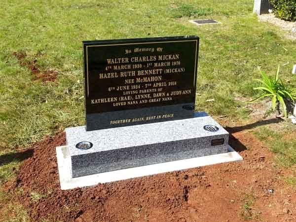 headstone on dirt