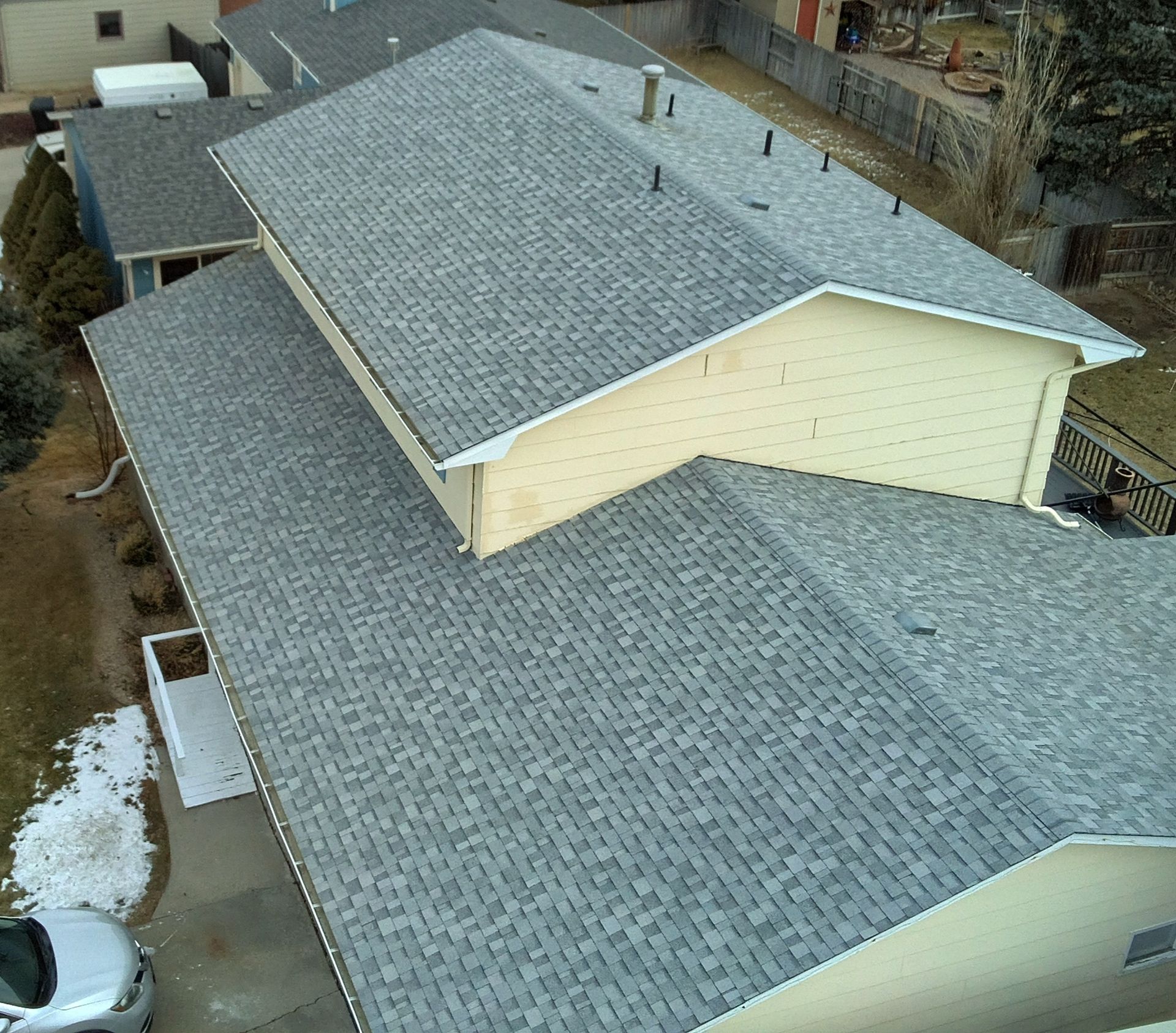 A roof with a window in the middle of it.