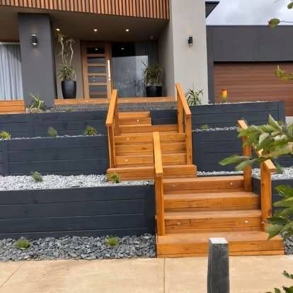 Wooden Stairs Leading to A Modern Home with Retaining Walls — MGP Landscaping in Geelong, VIC 
