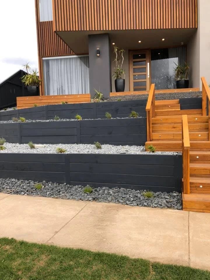 Modern House Exterior With Wooden Steps and Tiered — MGP Landscaping in Geelong, VIC