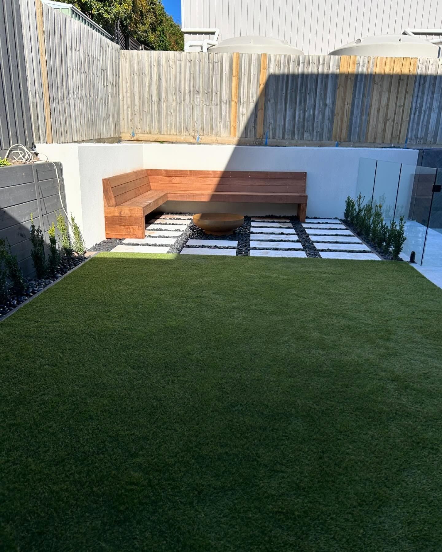 A Modern Backyard with Artificial Turf, Built-In Wooden Bench — MGP Landscaping in Geelong, VIC 