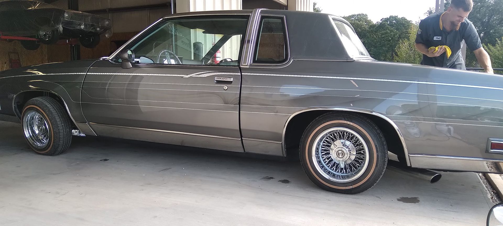 side profile of a grey vintage car 
