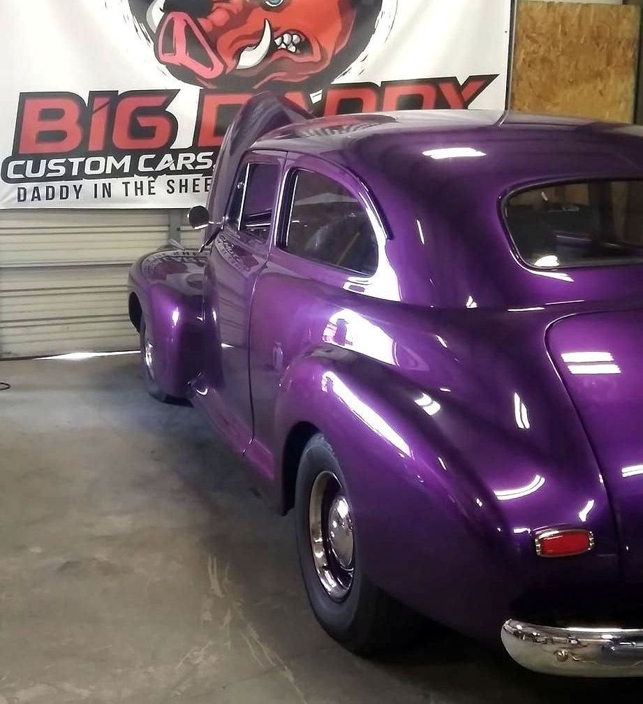 back profile of purple car 