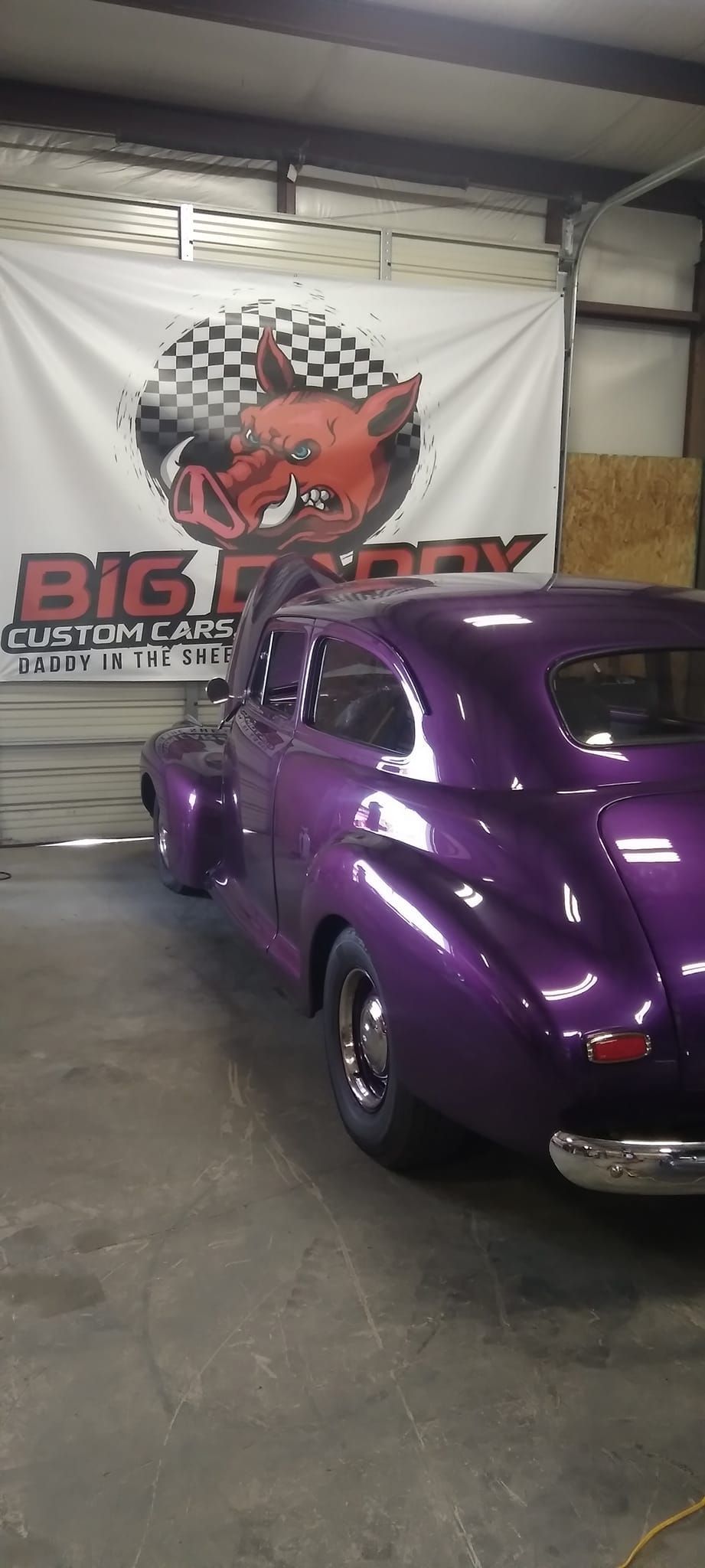 purple vintage car in the Big Daddy Customs shop 