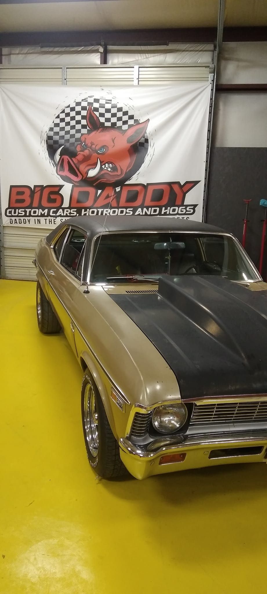 gold vintage car in the Big Daddy Customs shop