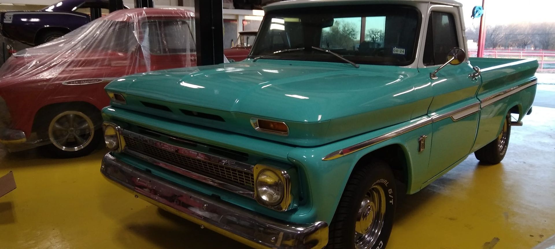 front profile of a teal vintage truck 
