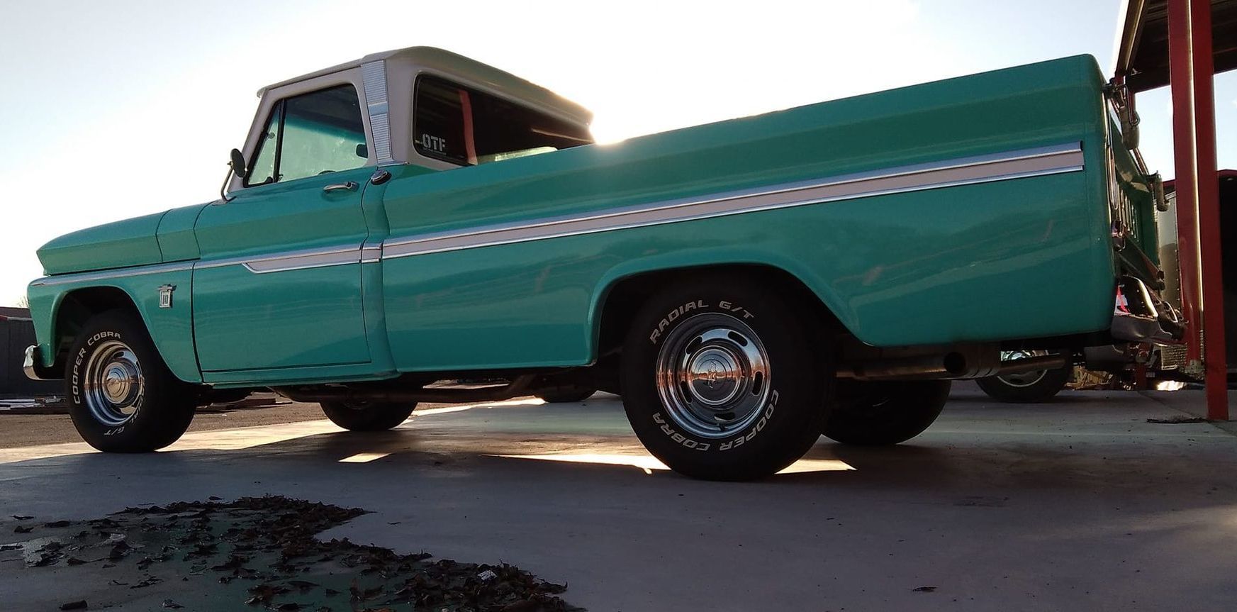 back profile of teal truck 