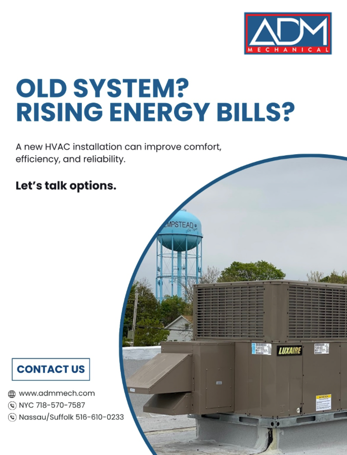 A gray air conditioner is sitting on a concrete platform outside of a house.