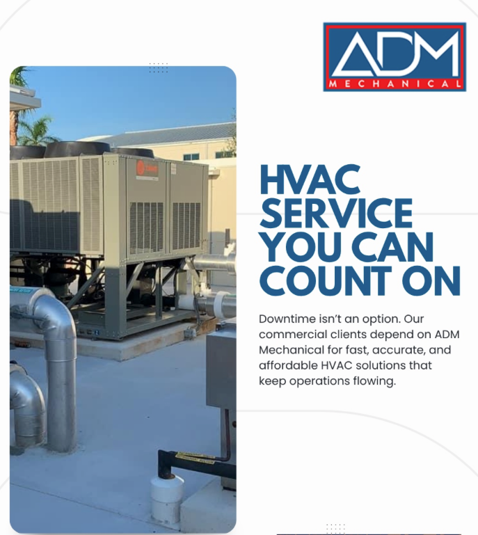 A gray air conditioner is sitting on a concrete platform outside of a house.