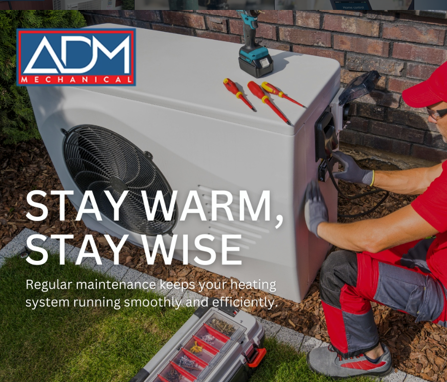 A gray air conditioner is sitting on a concrete platform outside of a house.