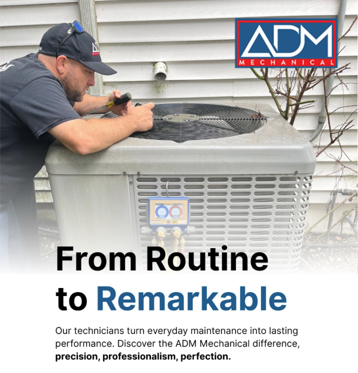 A gray air conditioner is sitting on a concrete platform outside of a house.