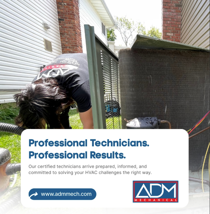 A gray air conditioner is sitting on a concrete platform outside of a house.