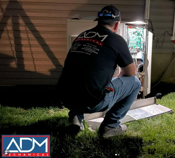 A fujitsu air conditioner is mounted on the side of a house.