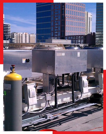A rooftop with a lot of electrical equipment on it
