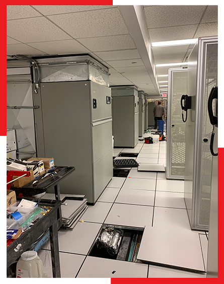 A room with a lot of cabinets and a phone on the wall.