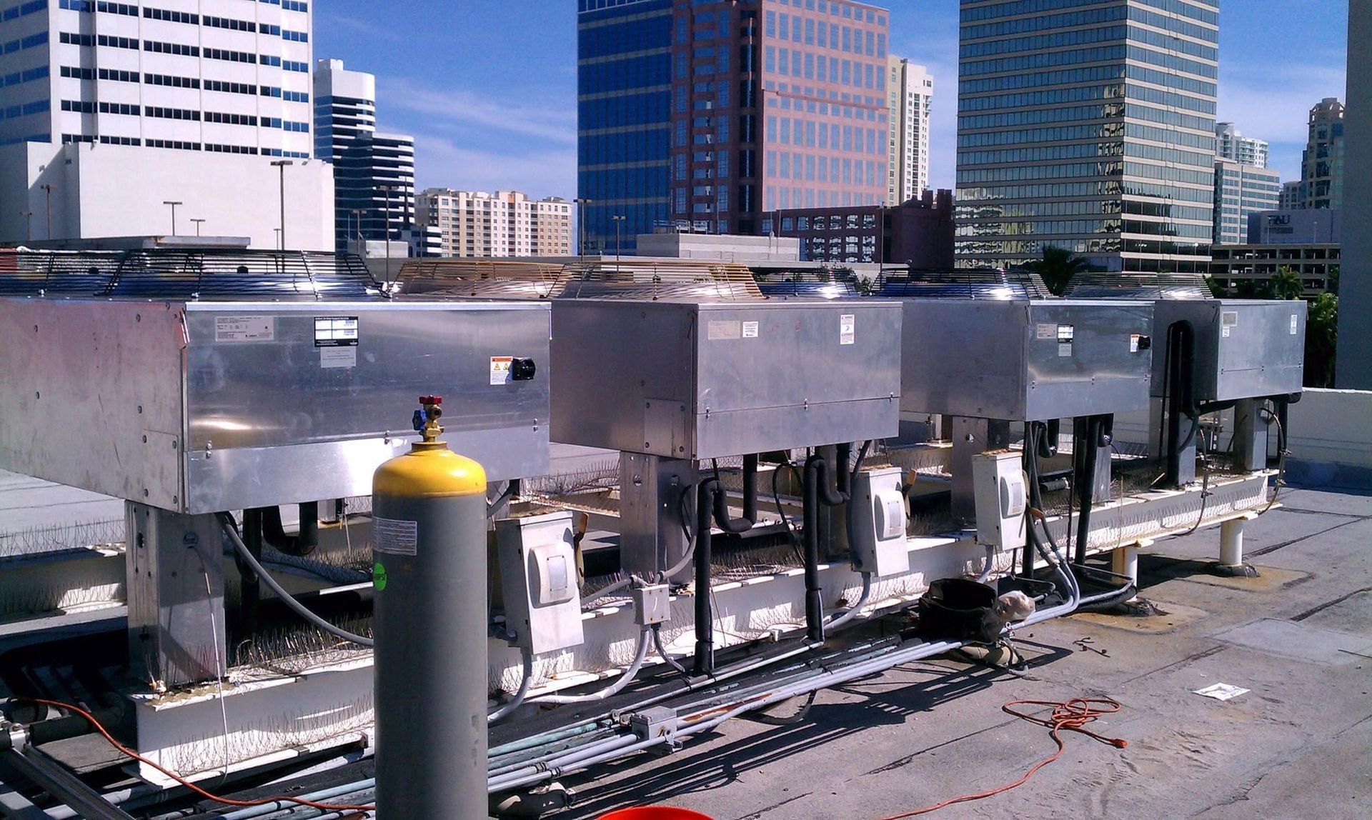 A rooftop of a building with a lot of machinery on it