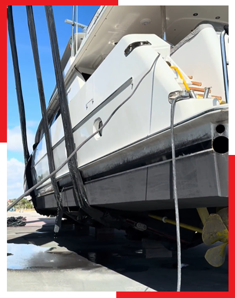 A white boat is tied to a dock with a rope