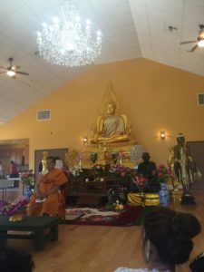 Asian family remembering their loved one at traditional asian funeral at Torres Cremation and Burial Services in CA.