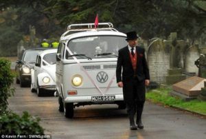 Volkswagon van and precession of VW vehicles at Torres Cremation and Burial Services CA