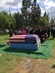Veteran Funeral Services with German Shepherd dog saying final goodbye at Torres Cremation and Burial Services CA