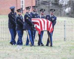 Veteran Funeral Services with military men carrying casket of fallen veteran at Torres Cremation and Burial Services CA