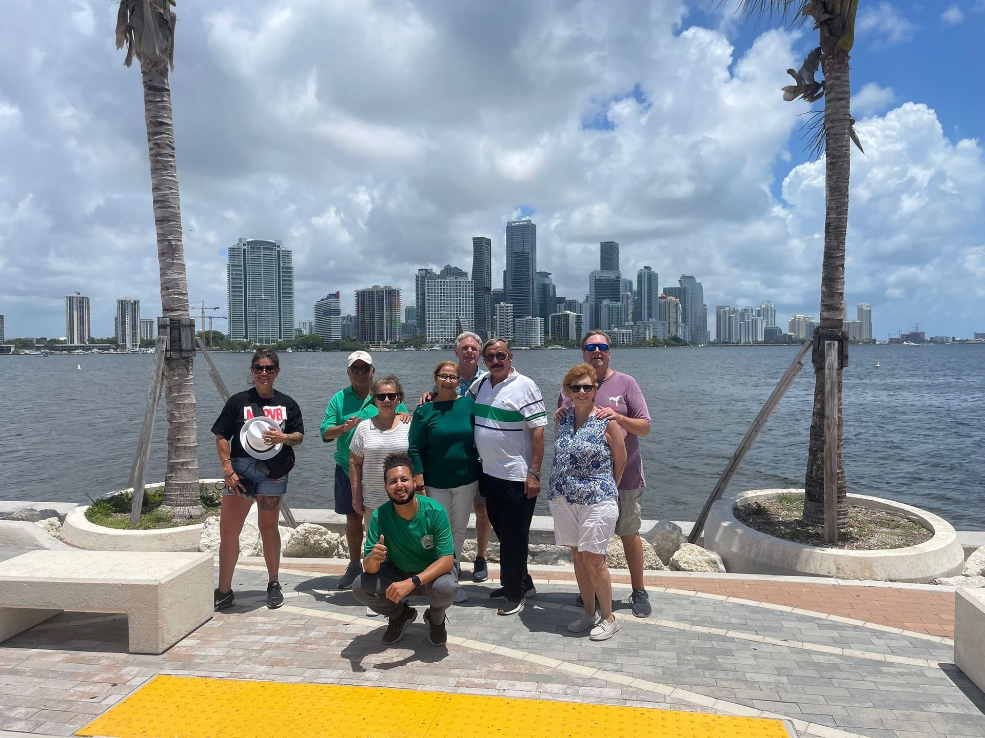 Passengers on the Secret Miami Skyline photo spot taking photo with tour guide