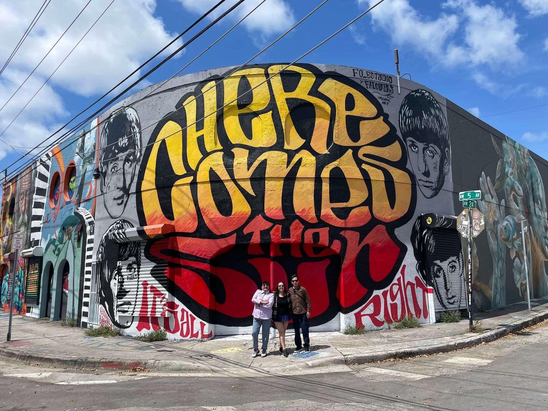 Wynwood Walls walking tour, passengers taking photos with the Murals on the Miami Hop on Hop off City Tour