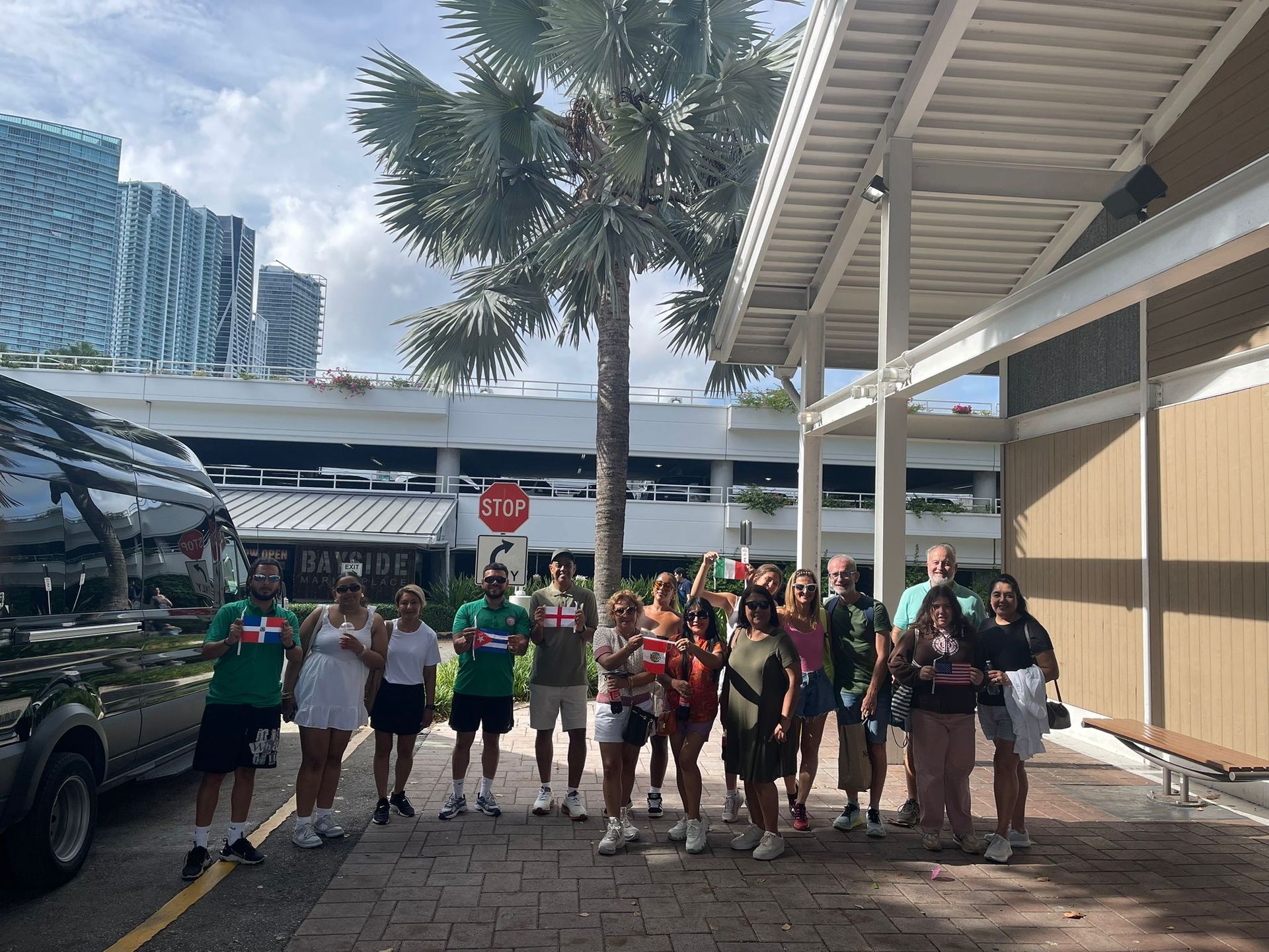 Miami Boat and Bus combo passengers holding flags