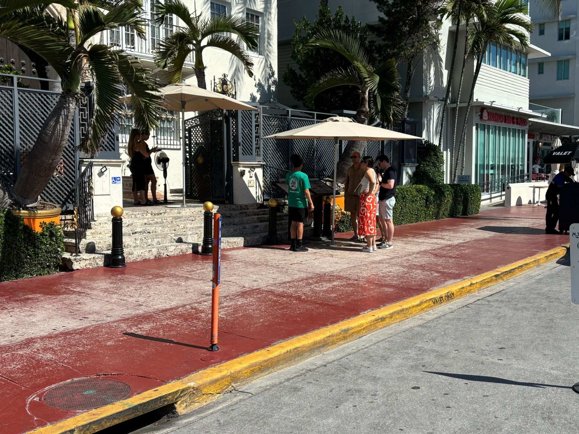 Guest and tour guide, hoping off in Ocean Drive to Visit the Versace Mansion in Ocean Drive