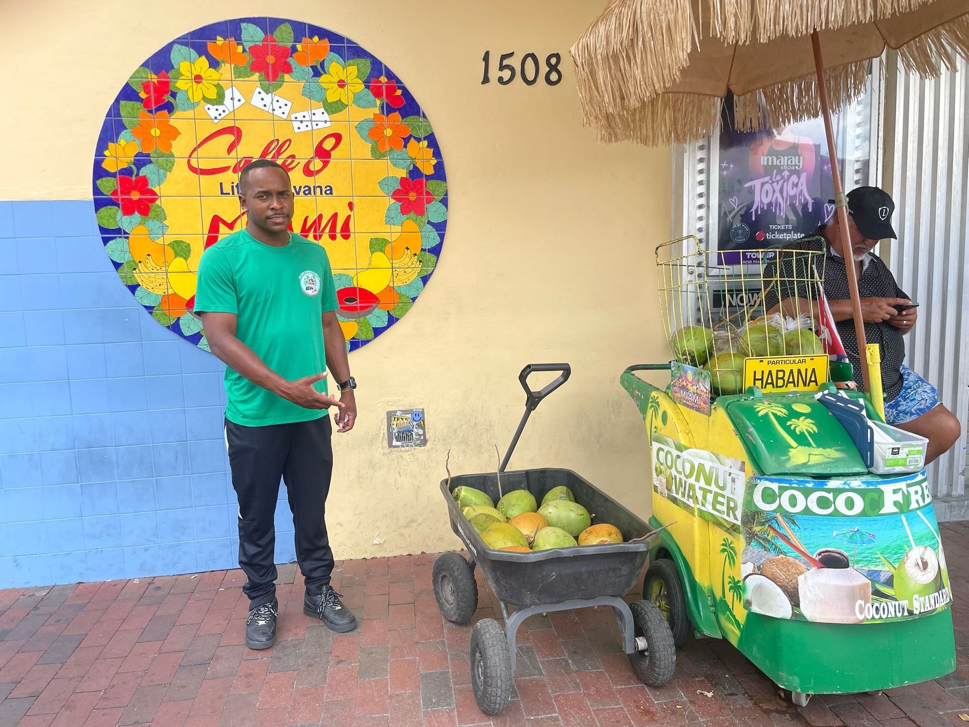 Hop on Hop off Tour Guide in Little Havana next to the Calle Ocho Mural