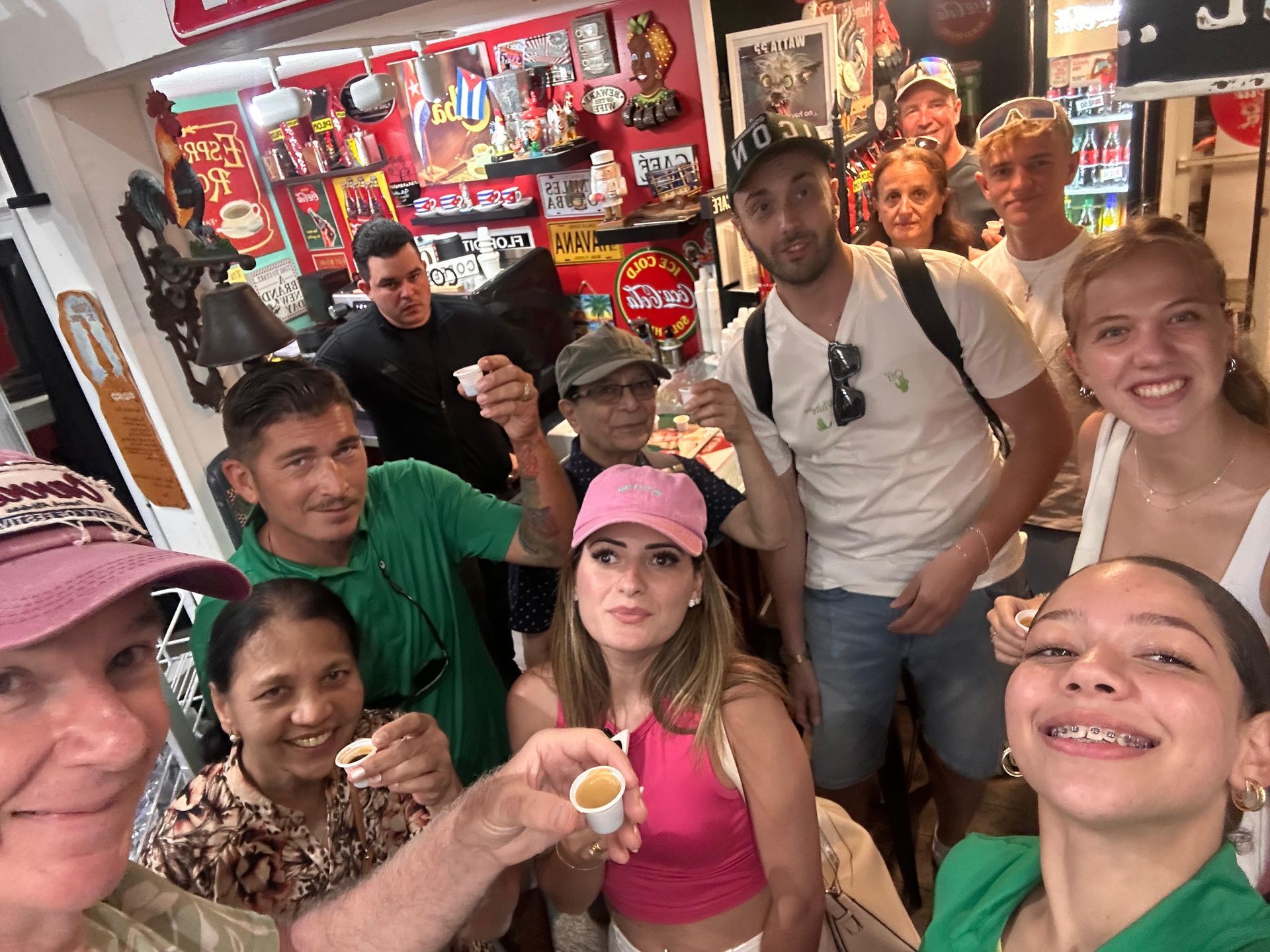 Team members of the Hop on Hop off Miami family with passengers in little Havana drinking Cuban Coffee 