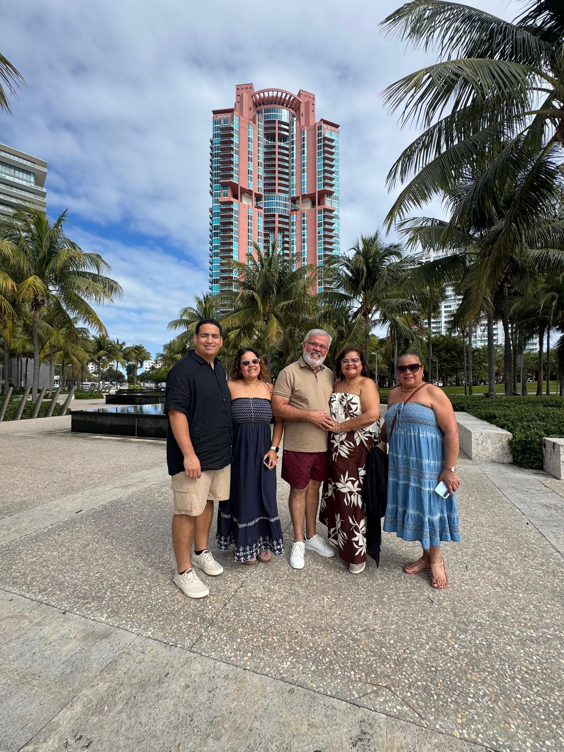 Guests posing in South Beach during a Hop On Hop Off Miami bus tour.
