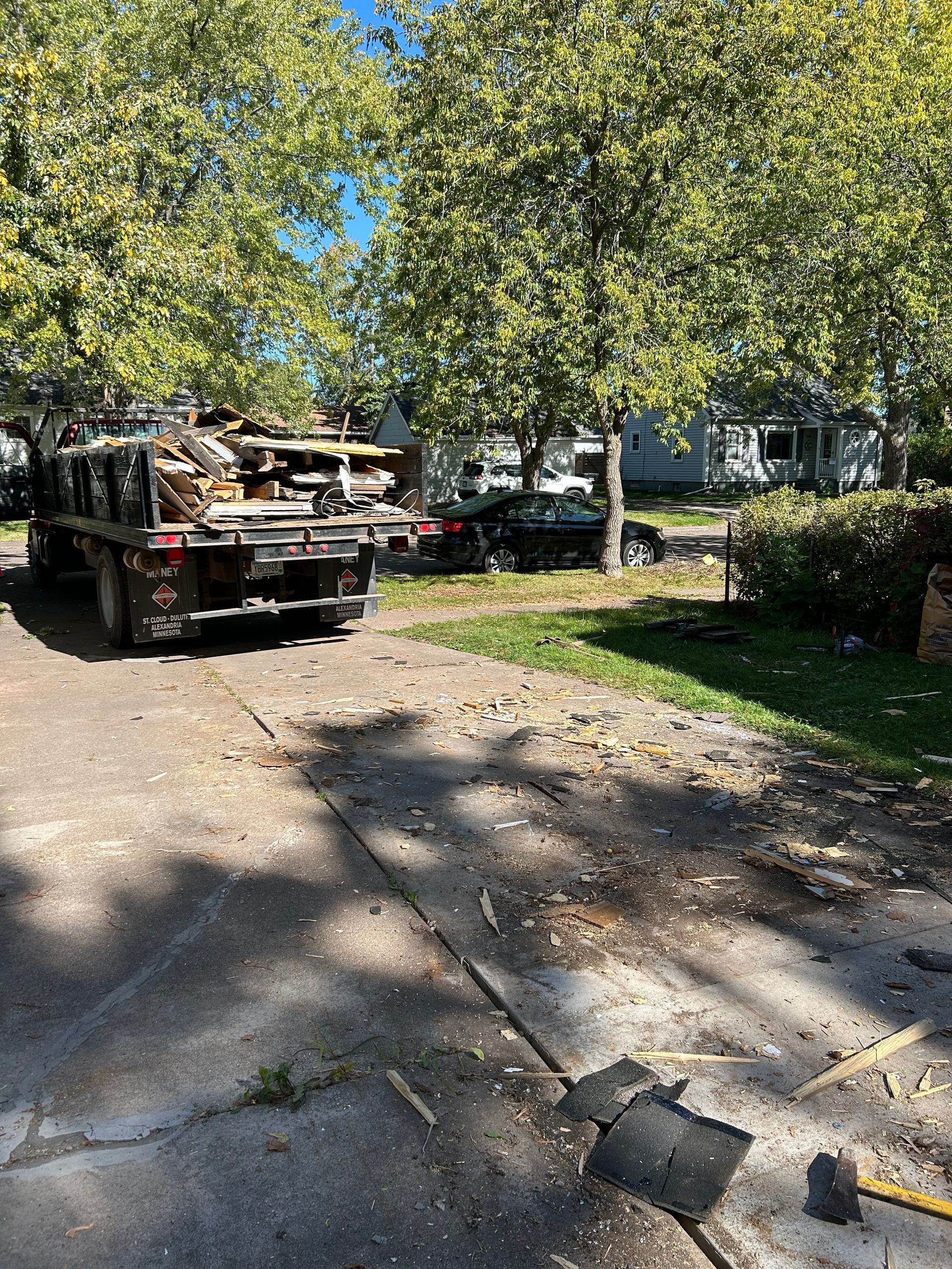 A tow truck is parked on the side of the road.